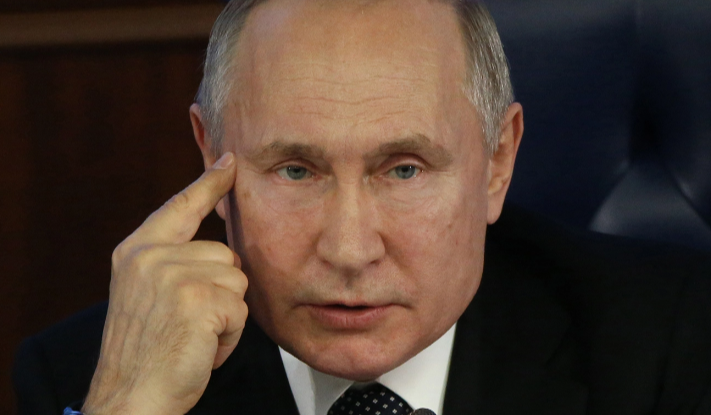 Putin vows to overcome hardships